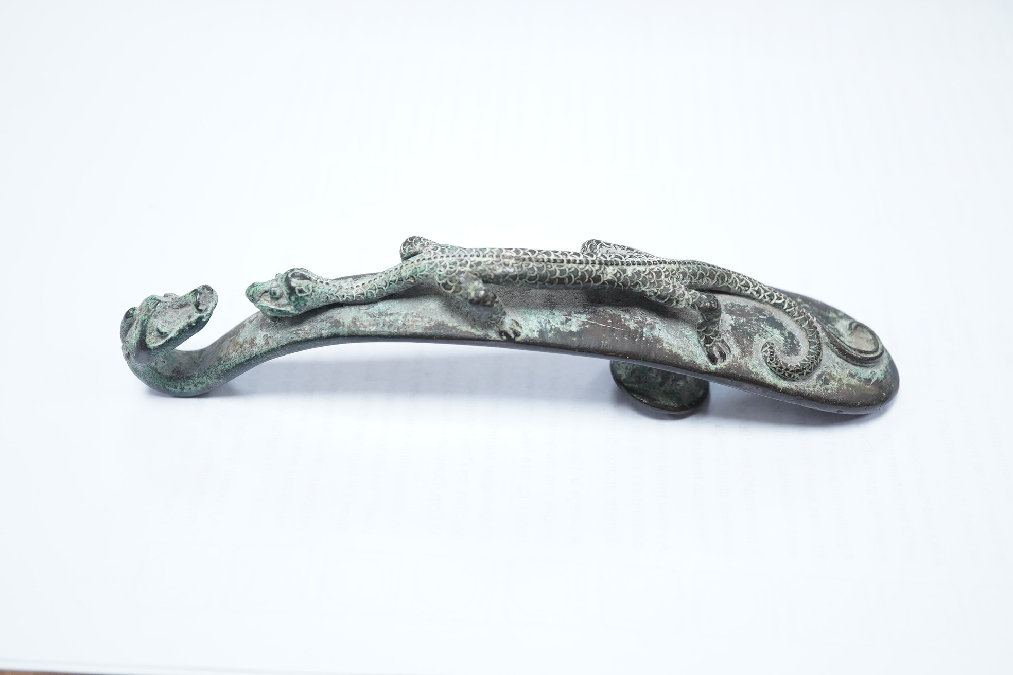 A Chinese bronze belt hook, Song Dynasty or later, 13.5cm wide. Condition - good condition for age